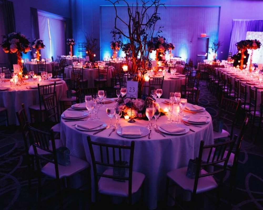 decorated-wedding-hall-with-candles-round-tables-centerpieces_8353-10057 (1)